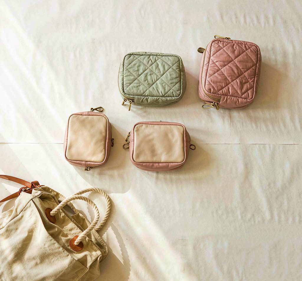 Pastel cosmetic pouches, coin purses and a matching shoulder strap